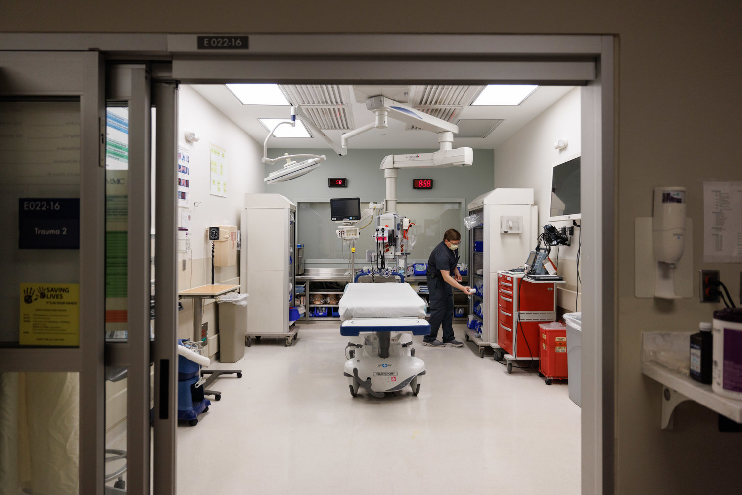 Registered Nurse Adrian Davis tidies up a Trauma Room in the Adult Emergency Department at the University of Mississippi Medical Center.